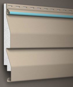 Beige vinyl siding with insulation backing showcases its sturdy, seamless design for durable home exteriors.
