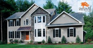 A beautiful suburban home showcases Charter Oak XL Premium siding, creating an inviting and elegant atmosphere.