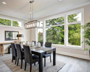 A sleek dining room, bathed in natural light, overlooks the NC Piedmont Triad, creating an inviting atmosphere.